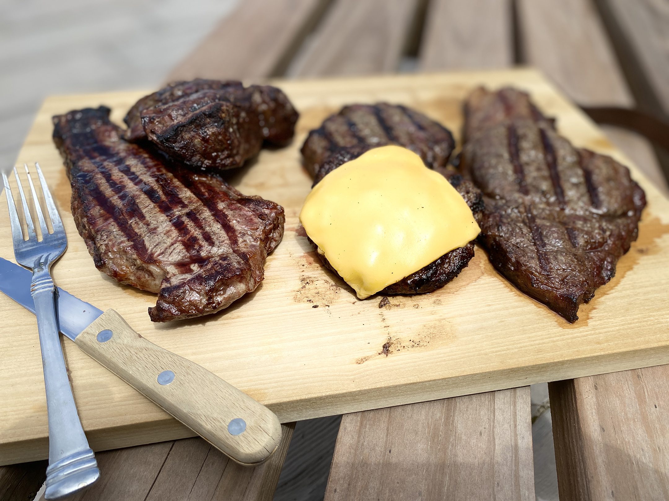 Cooked Wagyu cuts on cutting board