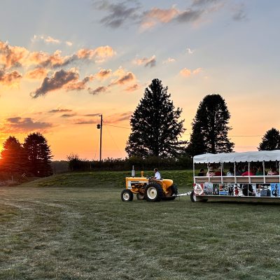 hansen's dairy trolley with guests at sunset