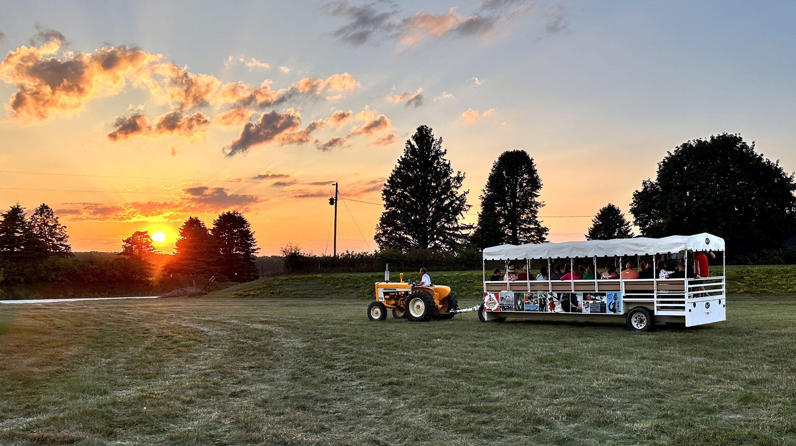 hansen's dairy trolley with guests at sunset